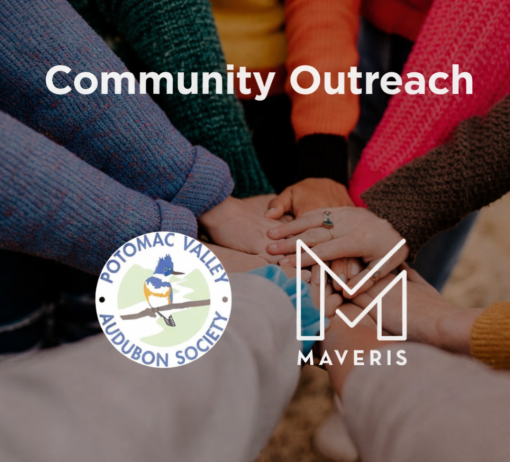 Lots of different hands rested atop each other indicating teamwork